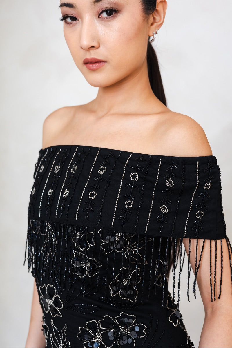 Elegant Raishma Felicity Gown with flowing fabric and intricate details, perfect for formal occasions or evening wear.