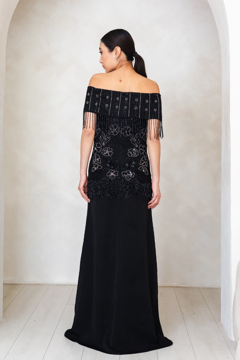 Elegant Felicity gown by Raishma featuring intricate embroidery and flowing fabric, perfect for formal occasions.