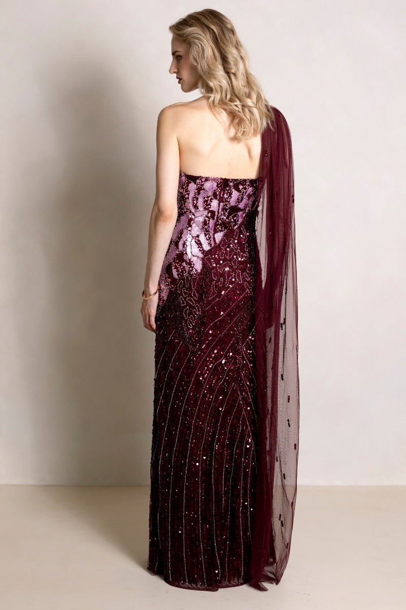Elegant Natalia Plum gown by Raishma, flowing fabric with intricate detailing, perfect for formal occasions.