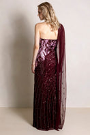 Elegant Natalia Plum gown by Raishma, flowing fabric with intricate detailing, perfect for formal occasions.