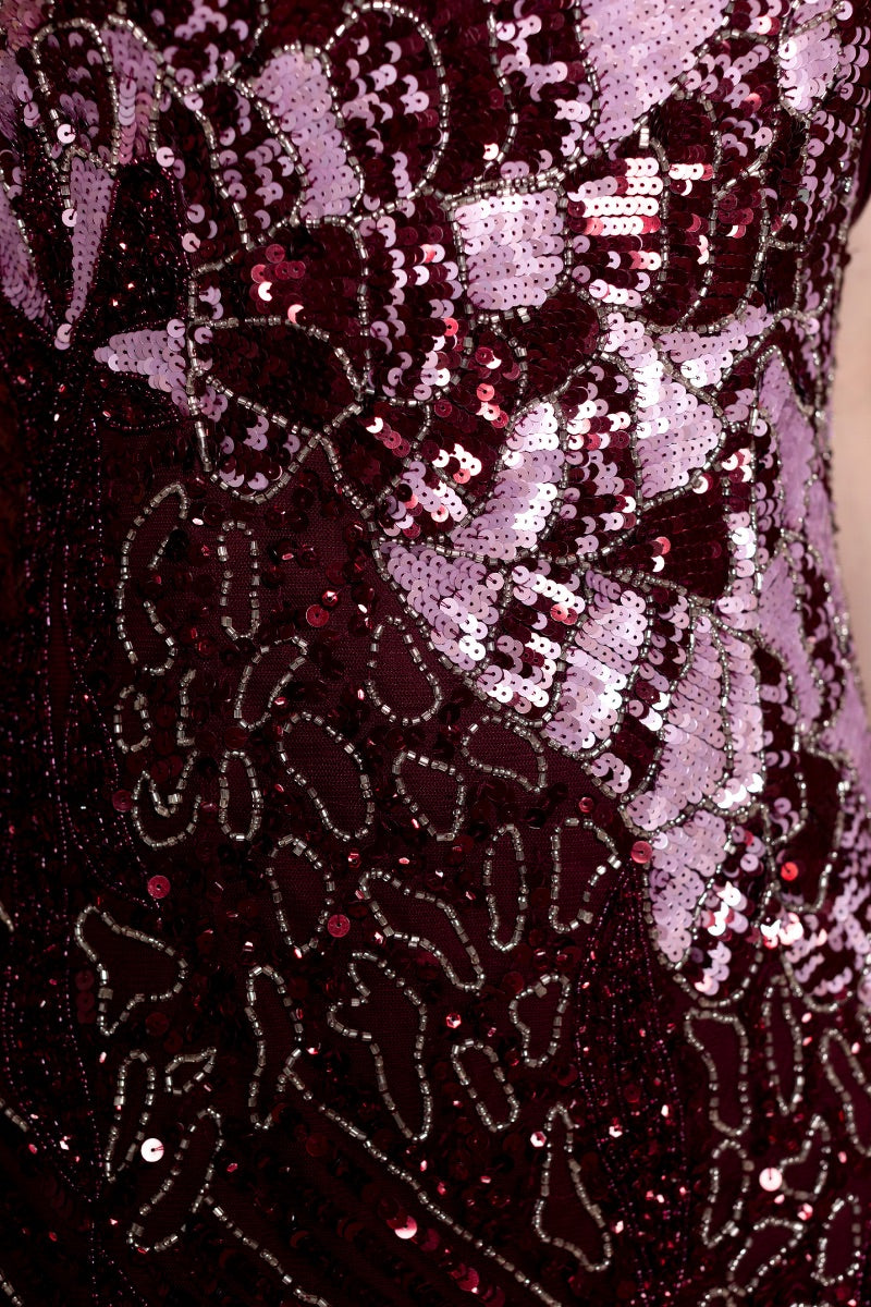 Elegant Natalia Plum gown by Raishma featuring flowing fabric and intricate detailing, perfect for formal occasions.