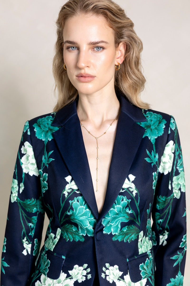 Raishma Jane jacket in blue, stylish women's jacket with a tailored fit, displayed on a hanger against a neutral background.