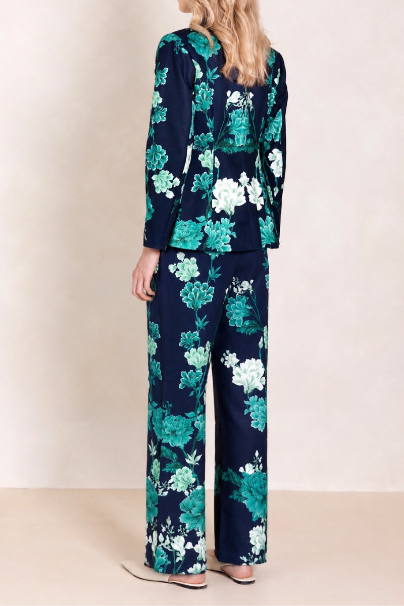 Raishma Jane jacket in vibrant blue, stylish blazer with tailored fit and lapel collar, displayed on a hanger.