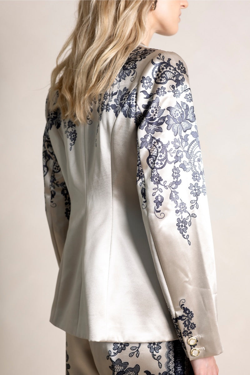 Raishma Jemma Gold Jacket, stylish women's tops with a shiny gold finish and tailored fit, shown on a hanger.