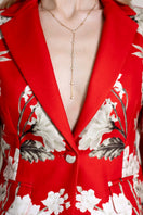 Raishma ZENA jacket displayed on a hanger, featuring a stylish tailored design with a smooth fabric finish.