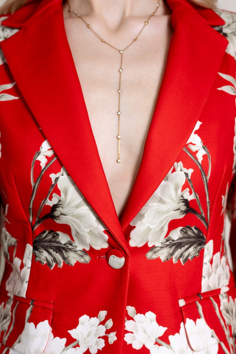 Raishma ZENA jacket displayed on a hanger, featuring a stylish tailored design with a smooth fabric finish.