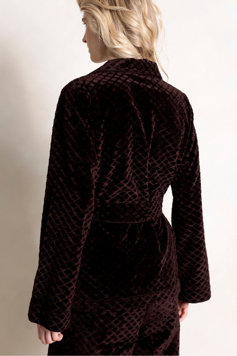 Raishma Viana Gold Loungewear Jacket displayed on a hanger, featuring a sleek gold fabric with a relaxed fit and stylish design.