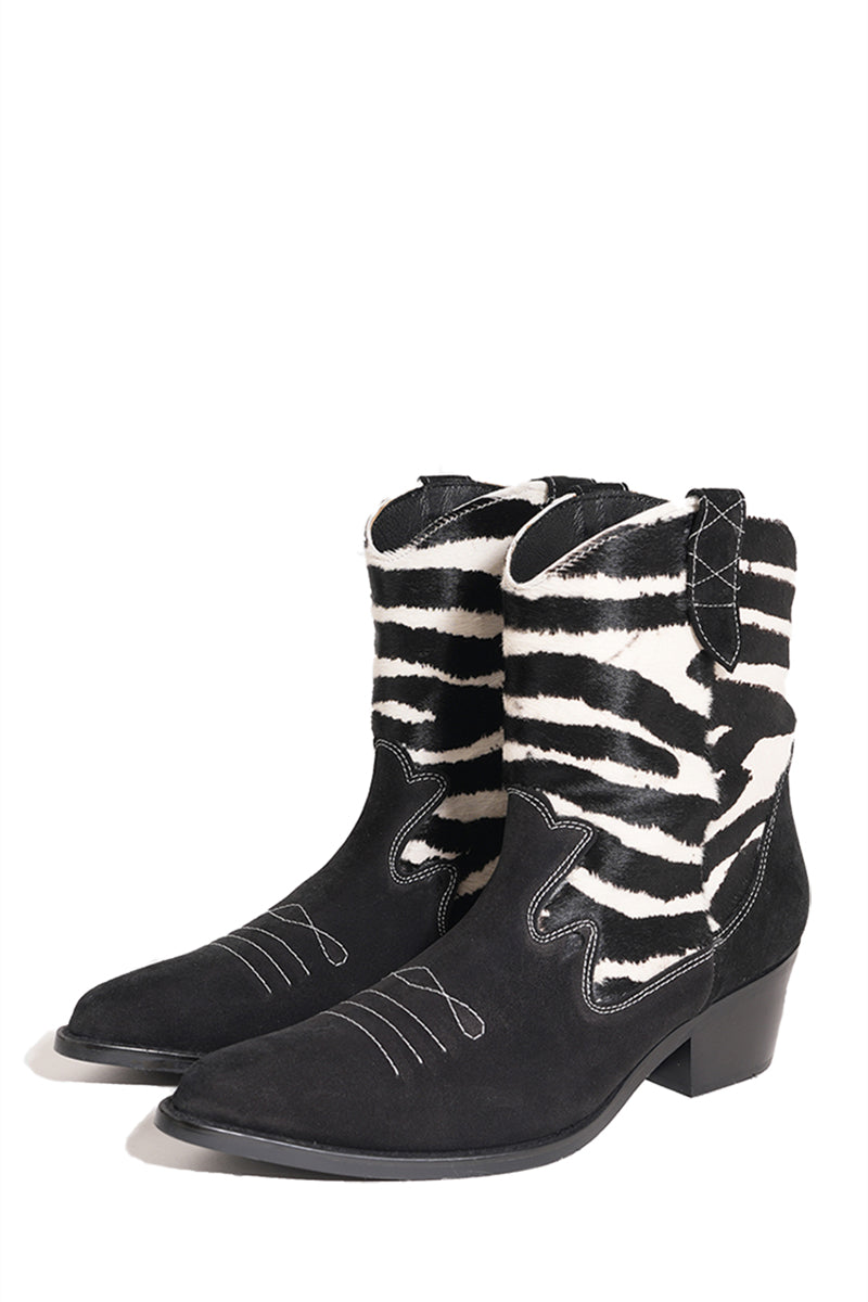 Je La Connais zebra ankle western boots in black and zebra print with pointed toes and western-style heel.