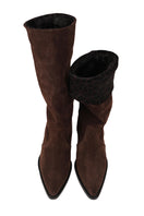 Brown suede boots by Je La Connais featuring a sleek design and ankle-height style.
