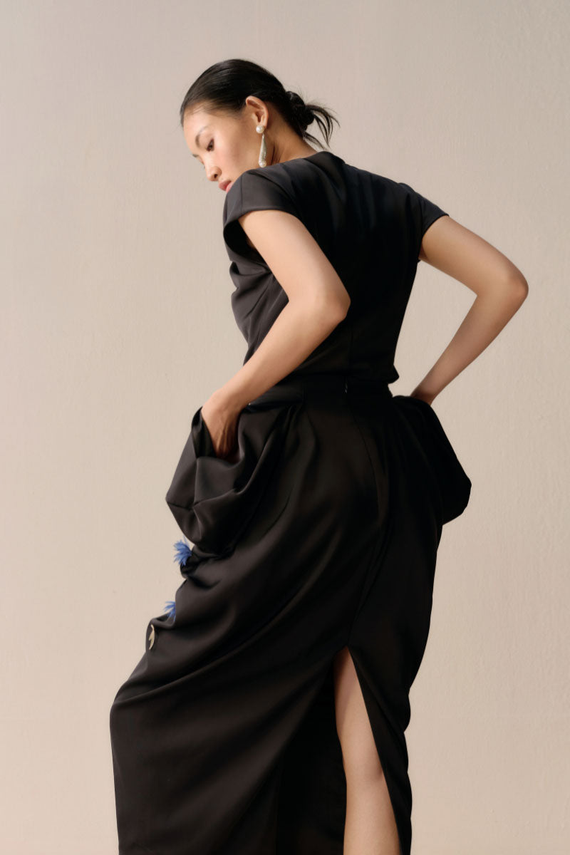 Full-brown A-line midi skirt by Leica, featuring a sleek design, in a rich brown color, styled with a smooth waistband.