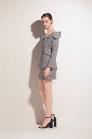 Multicolor tweed mini skirt by Valenciani featuring a fitted waist and stylish hem detail, perfect for fashionable casual wear.