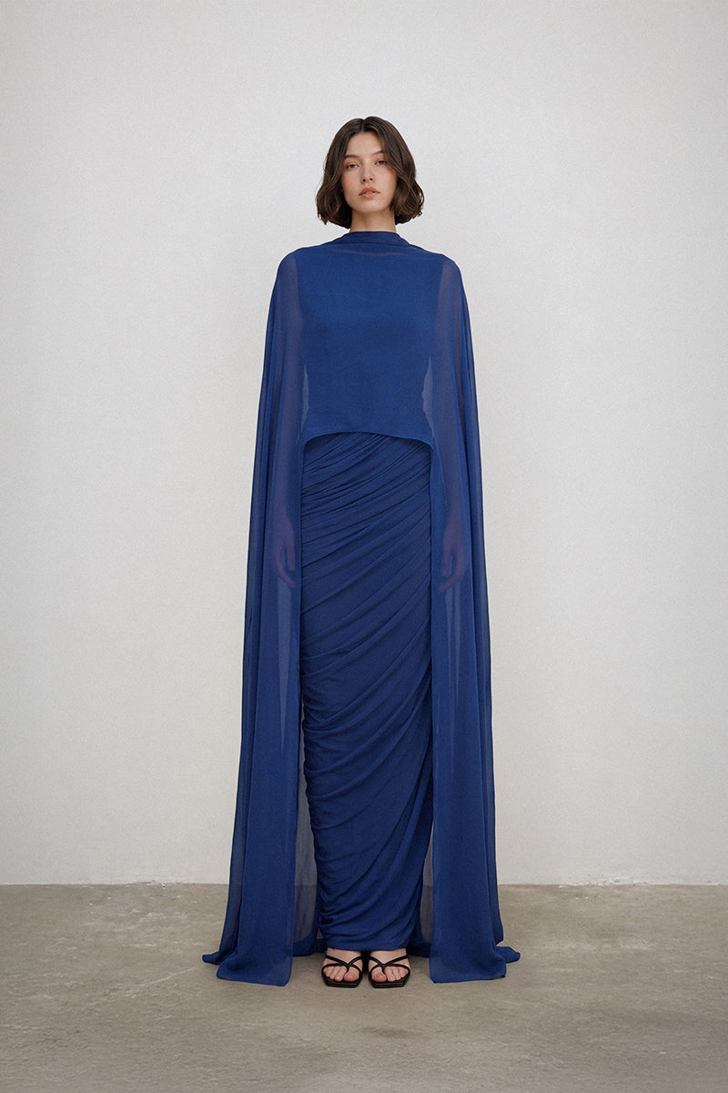 Elegant Deme By Gabriella AETHER gown with flowing fabric and intricate details, perfect for formal occasions.