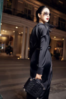 Black silk satin pleated midi dress by 21Six, featuring elegant pleats and a sleek, flowing silhouette.