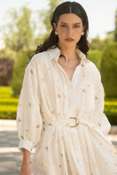 Estefania ivory gold camellia and lilies maxi shirt dress with floral print and flowing silhouette.