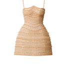 Nude mini shimmering dress by Phan Huy featuring a fitted silhouette and subtle sparkle, displayed on a hanger.