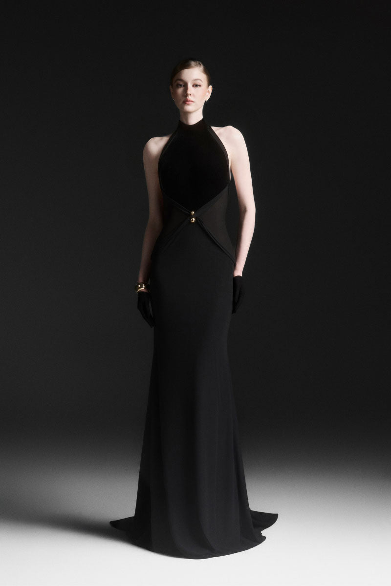 Black XANTHEIR Mermaid gown by Maison Des Copains, floor-length dress with fitted bodice and flowing skirt, showcased on a model.