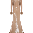 Sudi Etuz sheer sequin gown with faux fur trimmings, featuring elegant sparkle and luxurious fabric for special occasions.