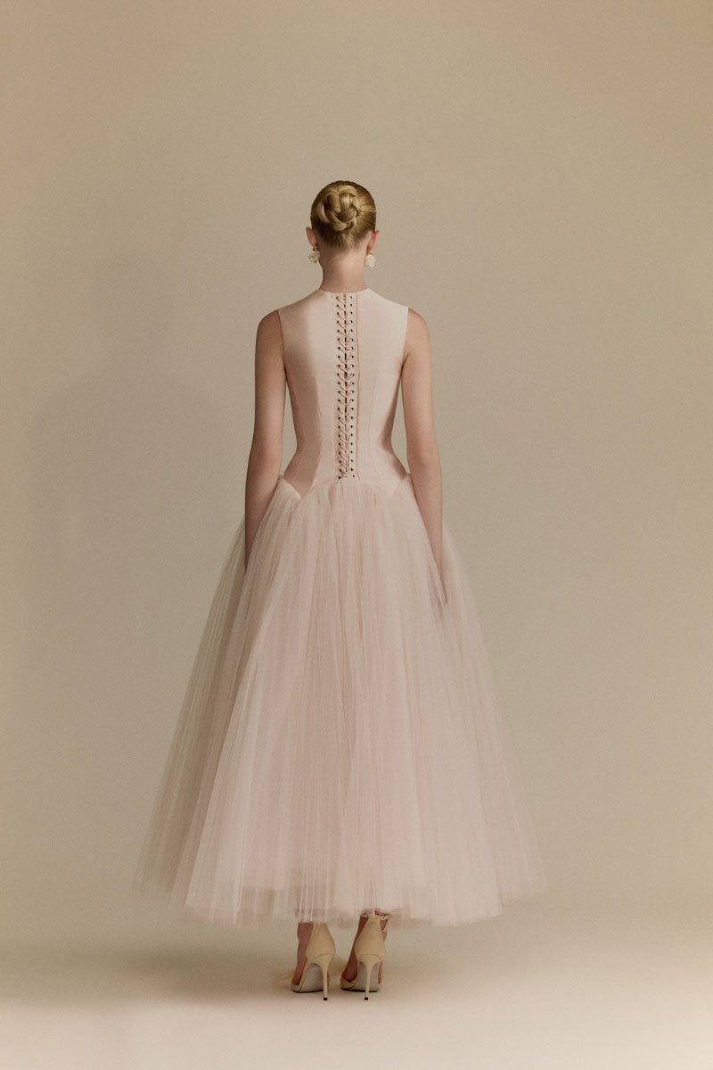 White Plan Magnolia Dress gown featuring elegant fabric and a flowing silhouette, perfect for formal occasions.