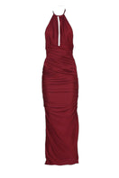 Aquarel Studio burgundy Stella maxi dress displayed on a hanger, showcasing its flowing fabric and elegant design.