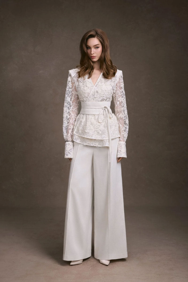 Wide-leg pants by KEIRA TONG featuring a relaxed fit, high waist, and flowing fabric, shown in a stylish full-body view.