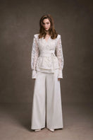 White wide-leg pants by Keira Tong, featuring a relaxed fit and high waist, displayed on a neutral background.
