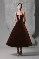 Brown velvet A-line midi dress with gold-beaded detail by Phan Huy, showcasing a stylish, elegant design.