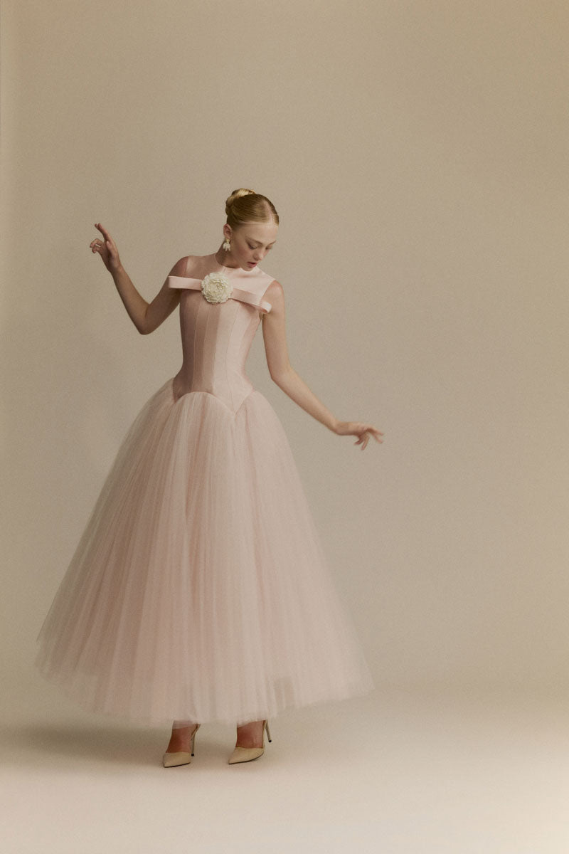 Elegant white Magnolia gown by White Plan, featuring a flowing design and delicate fabric for formal occasions.
