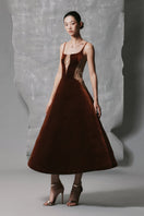 Brown velvet A-line midi dress with gold-banded detail by Phan Huy, featuring a fitted waist and elegant flowy fabric.