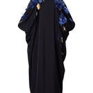 Black full-blown A-line midi skirt by Levia displayed on a hanger, showcasing its flowing fabric and classic silhouette.