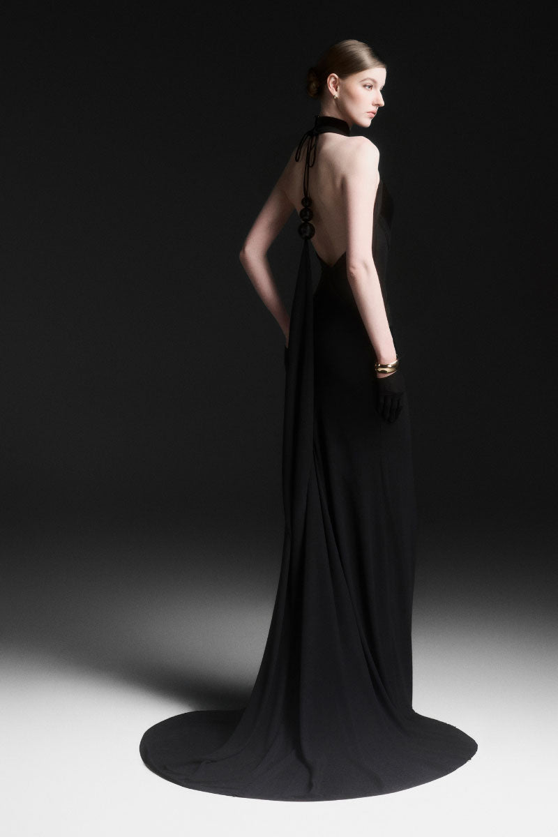 Black Xantheir Mermaid gown by Maison Des Copains, floor-length dress with a fitted silhouette and elegant design.