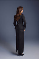 Black zipper peplum top by Keira Tong, featuring a fitted silhouette with a front zipper detail and peplum flare.
