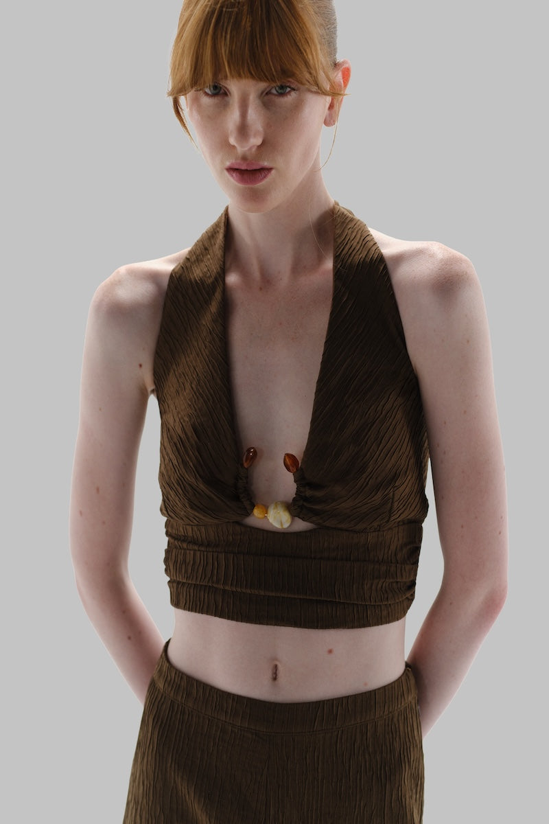 Baobab Louise Pants in espresso color, featuring a relaxed fit and stylish design, shown on a model.