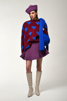 Lalo red multi-heart sweater display, featuring vibrant knitted pattern and cozy fit, perfect for casual winter wear.