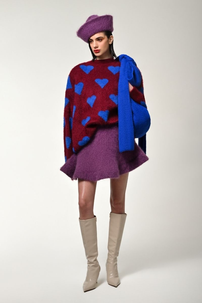 Lalo red multi-heart sweater display, featuring vibrant knitted pattern and cozy fit, perfect for casual winter wear.
