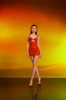 Red draped ruched mini dress and matching bra by CEM, featuring a stylish, fitted design with elegant ruching details.