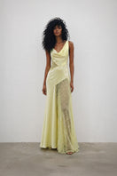 Elegant BIJOU DRESS gown by Deme By Gabriella with intricate embellishments and flowing fabric, showcased on a model.