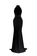 Black Xantheir Mermaid gown by Maison Des Copains with a floor-length design and elegant fitted silhouette, displayed on a dress form.