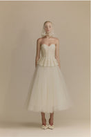 White Plan Anderson gown, elegant long dress with flowing fabric, perfect for formal occasions, shown on a model.