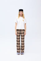 Brown checked ColoReve flat flared pants with a high waist and wide leg silhouette, shown on a model.