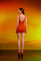 Red draped ruched mini dress and matching bra by CEM, featuring a stylish, fitted design with elegant ruching details.