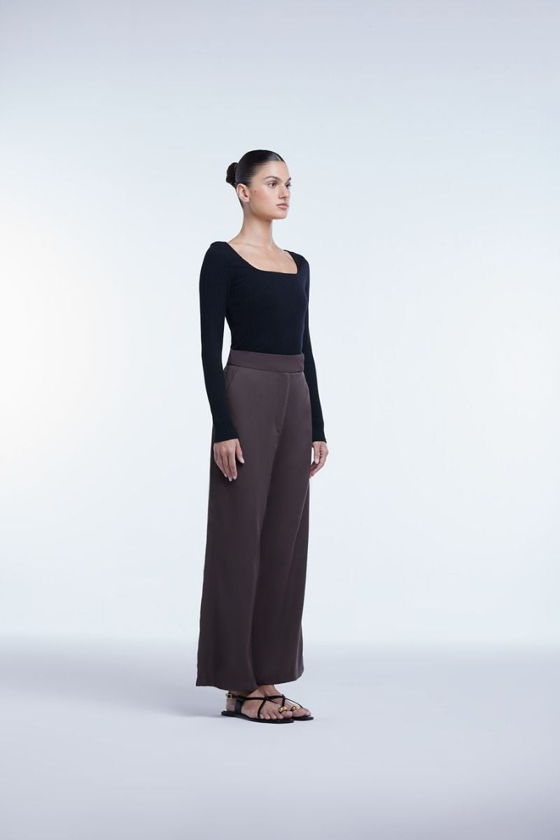 Relaxed wide-leg cropped pants by Dāl the Label, featuring a flowy silhouette and casual fit, shown in a neutral fabric.