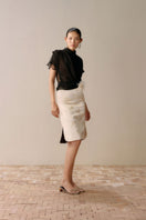 Ivory flowered pencil midi skirt by LeCia, featuring a fitted silhouette and floral pattern, shown on a model.