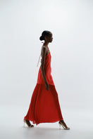 Baobab Gaia Maxi Dress in fiery red fabric, flowing maxi length with thin straps and elegant design perfect for summer wear.