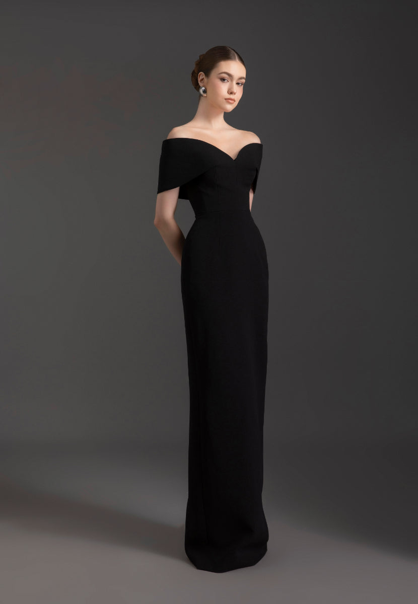 Le Thanh Hoa ELLE off-shoulder gown featuring elegant fabric and a flowing design, perfect for formal occasions.