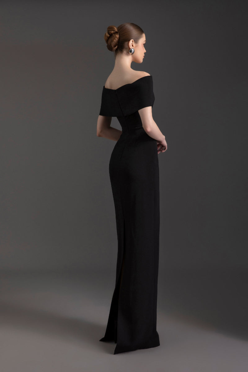 Elegant off-shoulder gown by Le Thanh Hoa featuring flowing fabric and a sophisticated design.