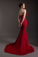 Elegant Scarlet Bloom mermaid gown by Le Thanh Hoa with intricate embroidery and a fitted silhouette, showcased on a model.