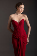 Elegant ruby red strapless gown by Le Thanh Hoa, featuring a flowing silhouette and intricate detailing.