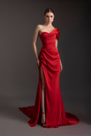 Le Thanh Hoa Ember Glow one-shoulder gown featuring flowing fabric and elegant design, perfect for formal occasions.