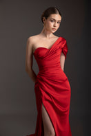Le Thanh Hoa Ember Glow one-shoulder gown featuring elegant fabric and sophisticated design, perfect for formal occasions.