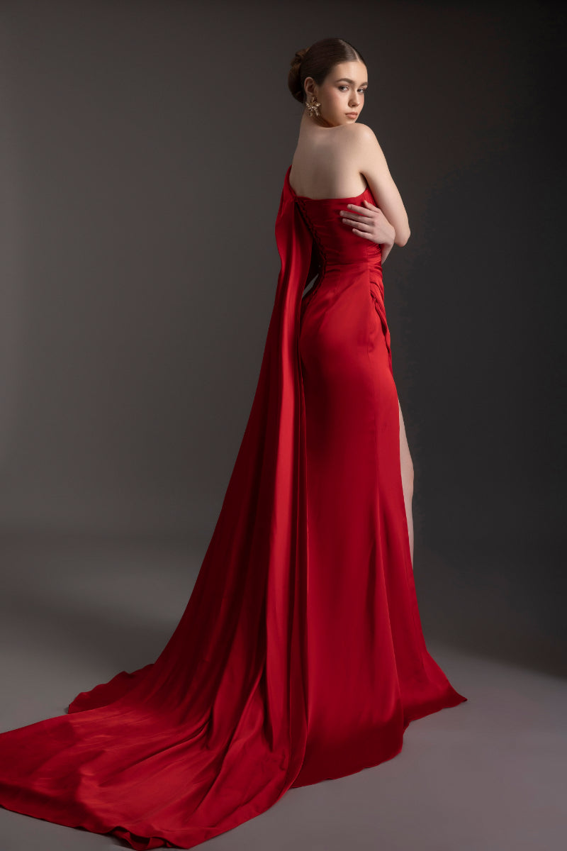 Le Thanh Hoa Ember Glow one-shoulder gown featuring elegant draping and a flowing silhouette, perfect for formal occasions.